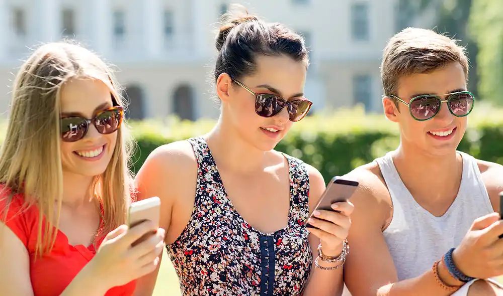 three young people are taking part in the Landventure scavenger hunt in Baden bei Wien
