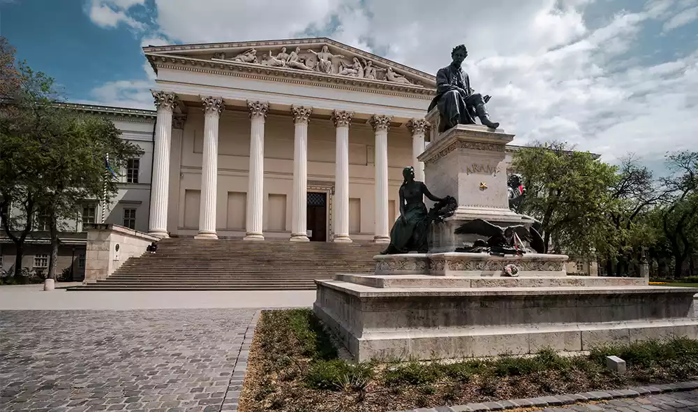 view of the Hungarian National Museum, with the statue ensemble of János Arany in the foreground