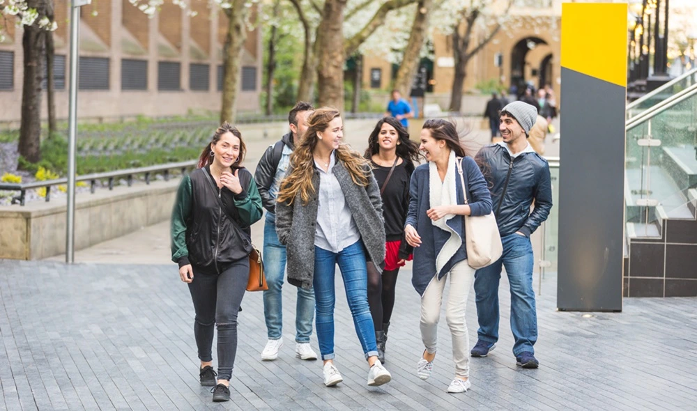 young group of friends playing a Landventure city adventure game as part of a class activity in Budapest
