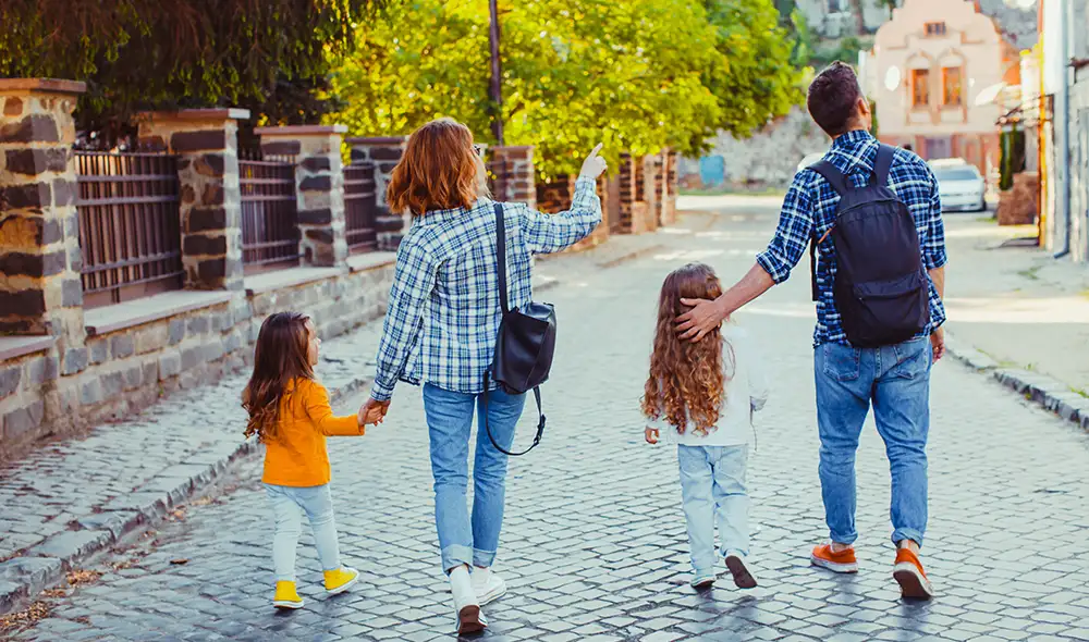 family experience gift: a family of four exploring the city in a Landventure detective game with their voucher