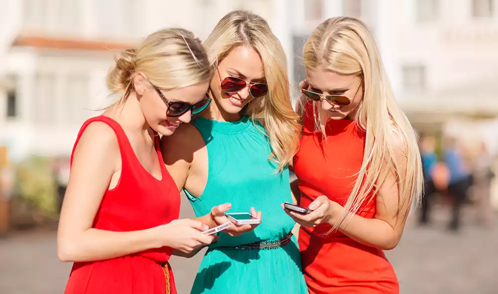 three women participate in a flexible outdoor bachelorette party program, embarking on a Landventure city mission